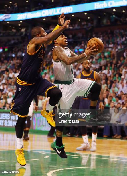 Isaiah Thomas of the Boston Celtics drives to the basket against Kyrie Irving of the Cleveland Cavaliers in the second half during Game One of the...