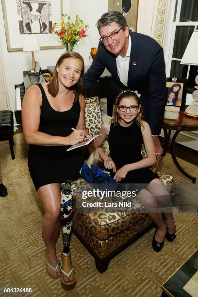 American Paralympic Triathlon Bronze Medalist Melissa Stockwell, Former American Olympic Swimmer Dr. Ron Karnaugh and Daniela Karnaugh attend the...