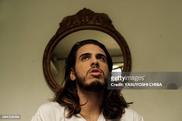 Davi de Oliveira Moreira, known as Sereio , speaks to AFP at his home in Rio de Janeiro, Brazil, on May 3, 2017. The 22-year-old Brazilian is part of...