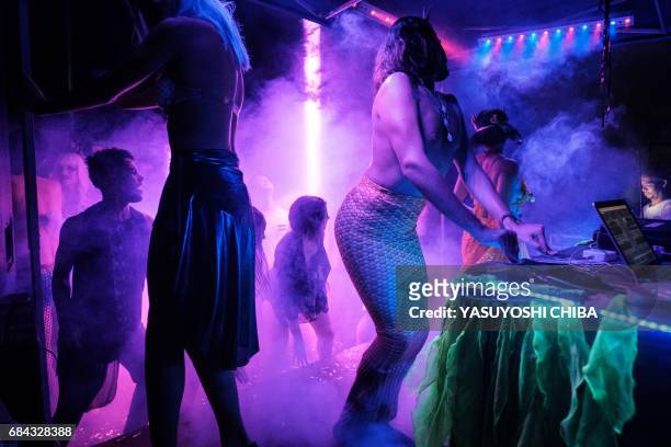 Davi de Oliveira Moreira , known as Sereio , dances during the "Mermaids of Guanabara Bay" party in Rio de Janeiro, Brazil, on May 7, 2017. The...