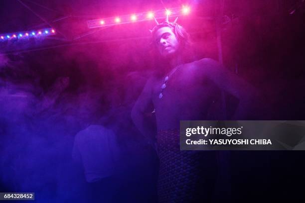 Davi de Oliveira Moreira, known as Sereio , dances during the "Mermaids of Guanabara Bay" party in Rio de Janeiro, Brazil, on May 7, 2017. The...