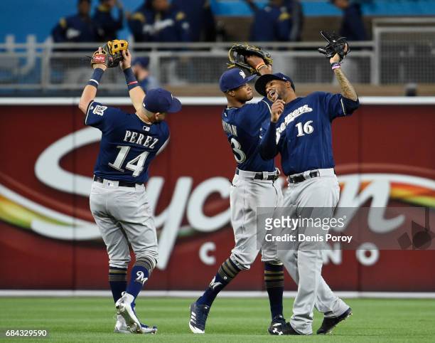 Hernan Perez of the Milwaukee Brewers, Keon Broxton, and Domingo Santana celebrate after beating the San Diego Padres 3-1 in a baseball game at PETCO...