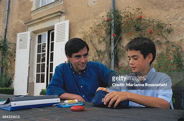French politician François Fillon with his son Edouard, 1st September 2002. Fillon is Minister of Social Affairs, Labour and Solidarity in the...