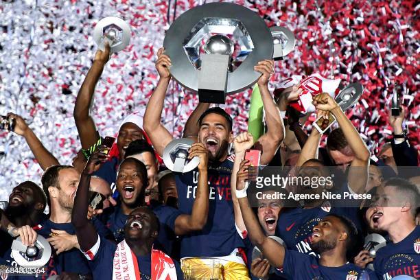 Radamel Falcao lift the trophy and players of Monaco celebrate winning the Ligue 1 title after the Ligue 1 match between As Monaco and AS Saint...