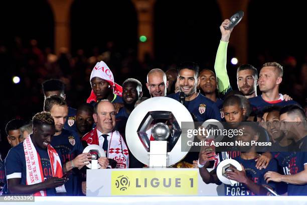 Prince Albert of Monaco, Radamel Falcao lift the trophy and players of Monaco celebrate winning the Ligue 1 title after the Ligue 1 match between As...