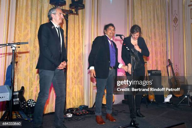 Singer Laurent Voulzy and his musicians acknowledge the applause of the audience at the end of the "Vaincre Le Cancer" Gala - 30th Anniverary at...