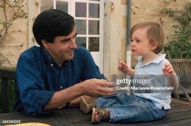 French politician François Fillon with his son Arnaud, 1st September 2002. Fillon is Minister of Social Affairs, Labour and Solidarity in the...