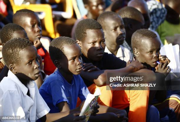 South Sudanese refugees take reading lessons at the UNHCR camp of al-Algaya in Sudan's White Nile state, south of Khartoum, on May 17, 2017. More...