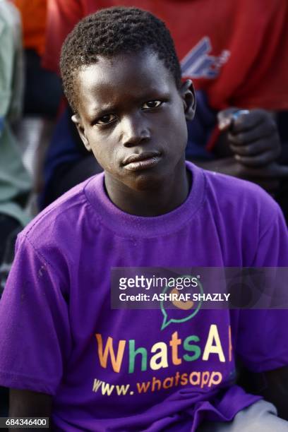 South Sudanese refugee boy sits at the UNHCR camp of al-Algaya in Sudan's White Nile state, south of Khartoum, on May 17, 2017. More than 95,000...