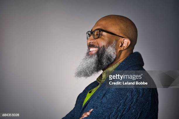 portrait of middle aged bald african american man with beard - bald man foto e immagini stock