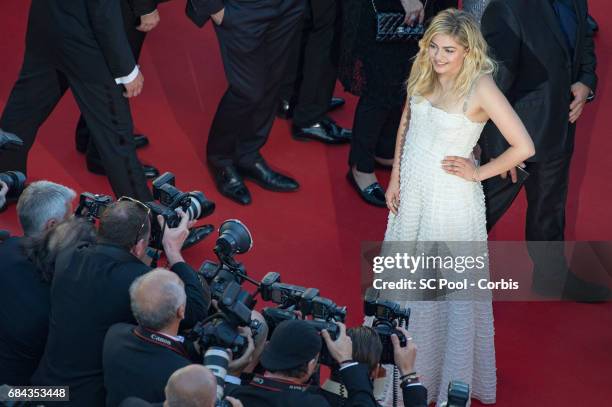 Actress Louane Emera poses for the photographers before the "Ismael's Ghosts " screening and Opening Gala during the 70th annual Cannes Film Festival...