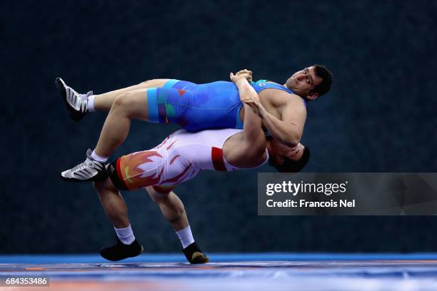 Muminjon Abdullaev of Uzbekistan and Sabah Shariati of Azerbaijan competes in the Mens Greco Roman Wrestling 130 kg Semi Final during day six of Baku...