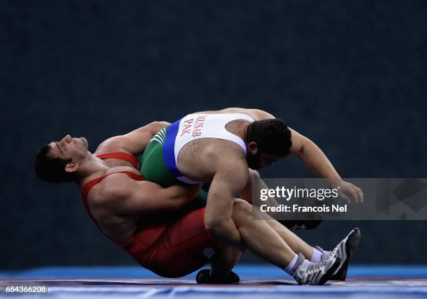 Sabah Shariati of Azerbaijan compete against Akram Khan Musab of Pakistan in the Mens Greco Roman Wrestling 130 kg Quater Finals during day seven of...