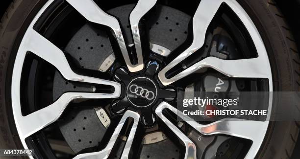 The logo of the German car producer Audi is seen on a wheel of a car displayed at Audi's annual general meeting in Neckarsulm, Germany, on May 18,...