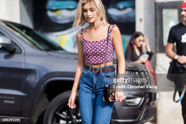 Sarah Ellen wearing a red white top, denim jeans outside Ten Pieces at day 5 during Mercedes-Benz Fashion Week Resort 18 Collections at Icebergs on...