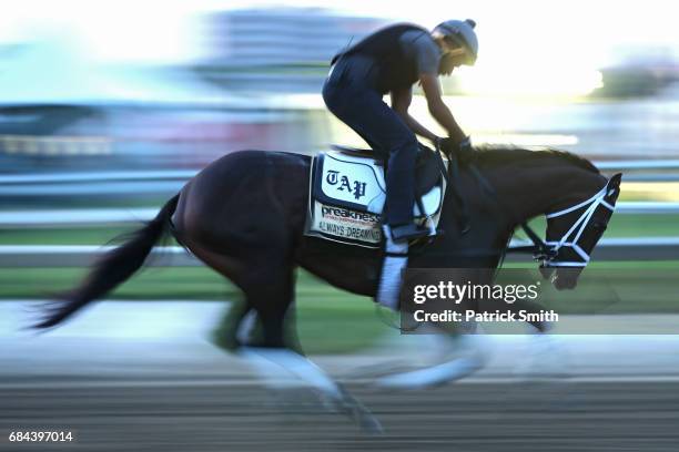 Kentucky Derby winner Always Dreaming trains on track during a training session for the upcoming Preakness Stakes at Pimlico Race Course on May 18,...