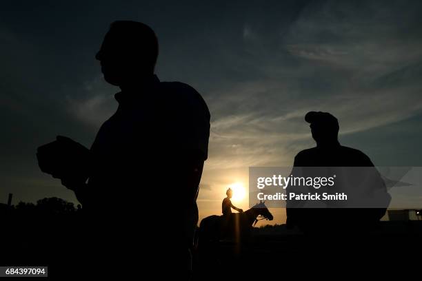 Trainer Todd Pletcher for Kentucky Derby winning horse Always Dreaming walks off of the track following a training session for the upcoming Preakness...