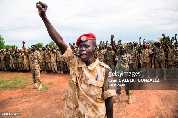 Soldiers of the Sudan People's Liberation Army cheer cheer during the commemoration of Sudan People's Liberation Army Day at the SPLA headquarters in...