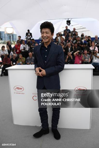 Japanese actor Takuya Kimura smiles on May 18, 2017 during photocall for the film 'Blade of the Immortal' at the 70th edition of the Cannes Film...