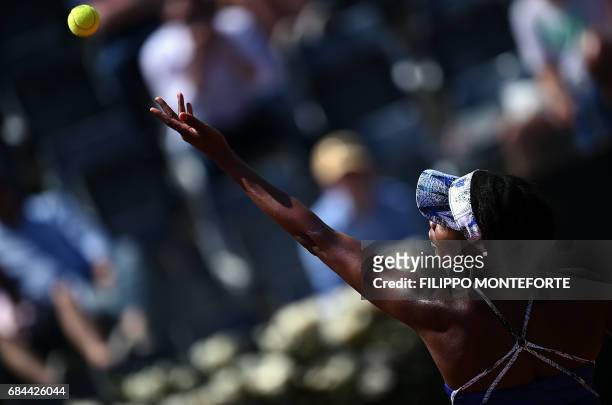 The US's Venus Williams serves the ball to Britain's Johanna Konta during their match at the WTA Tennis Open tournament on May 18, 2017 at the Foro...