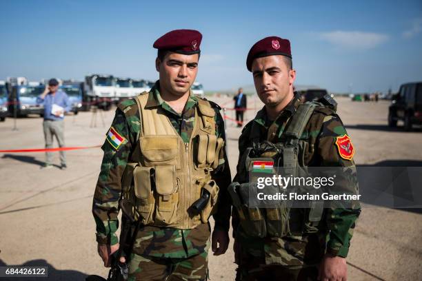Bashiqa, Iraq Two Kurdish soldiers posing in front of the camera on April 20, 2017 in Bashiqa, Iraq.