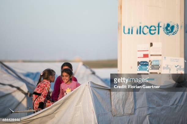 Hasansham, Iraq Children in the refugee camp 'Hasansham U3'. In the background the Unicef logo is printed on a container on April 20, 2017 in...