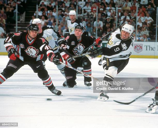 Stanley Cup Finals: Dallas Stars Mike Modano in action vs Buffalo Sabres Stu Barnes and Wayne Primeau during Game 2 at Reunion Arena. Dallas, TX...