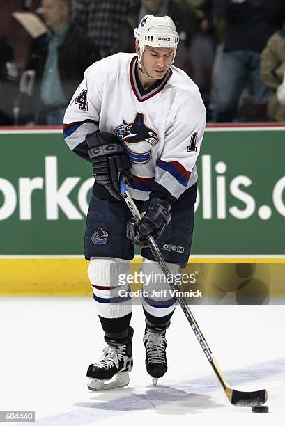 Defenseman Scott Lachance of the Vancouver Canucks skates with the puck before the NHL game against the Phoenix Coyotes on April 7, 2002 at General...