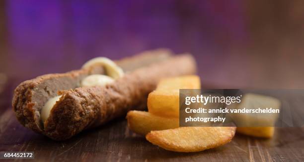 frikandel, french fries and mayonnaise. - frikadel stock-fotos und bilder