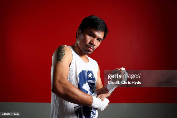 Manny Pacquiao warps his hands before a training session at the Elorde boxing Gym on May 19, 2017 in Manila, Philippines.