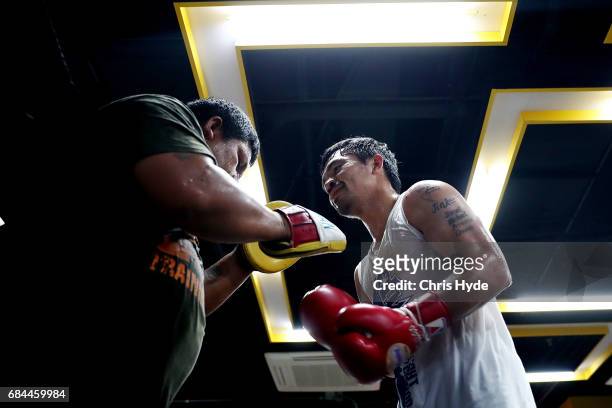 Manny Pacquiao hits the pads with Buboy Buboy Fernandez at Elorde boxing Gym on May 19, 2017 in Manila, Philippines.