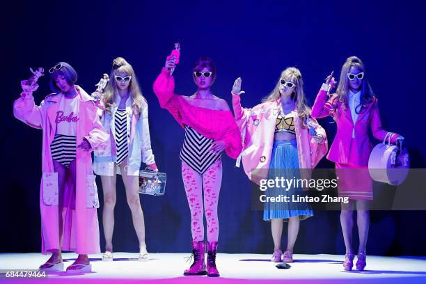 Models showcases designs on the runway at The School of Fashion Art and Engineering, Beijing Institute of Fashion Technology & Faculty of Art and...