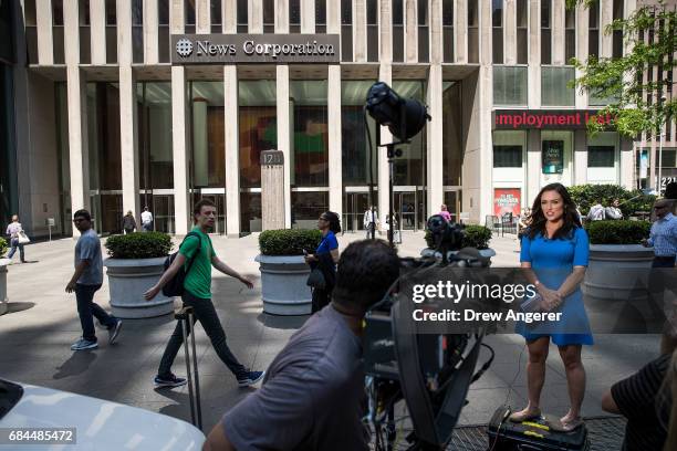 Reporter films a live shot outside of the News Corporation building, which houses the Fox News studios, May 18, 2017 in New York City. Roger Ailes,...