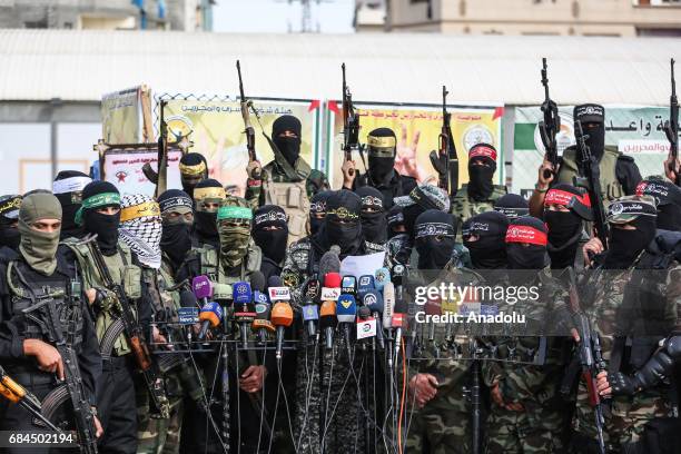 Members of Palestinian armed groups hold a press conference to show solidarity with Palestinian prisoners held in Israeli Prisons on May 18, 2017 in...