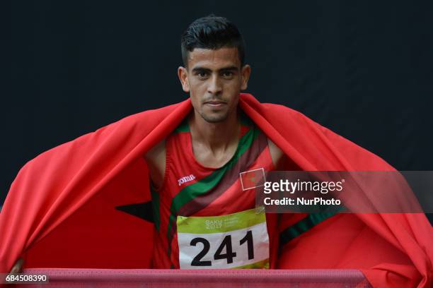 Mohamed Tindouft of Morocco celebrates his win in Men's 3000m Steeplechase final, during an athletic event at Baku 2017 - 4th Islamic Solidarity...