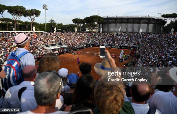 The crowds watch as Juan Martin Del Potro of Argentina serves to Kei Nishikori of Japan during their 3rd round match in The Internazionali BNL...