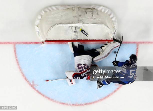 Jimmy Howard of the USA saves a shot by Juhamatti Aaltonen of Finlandk during the 2017 IIHF Ice Hockey World Championship quarter final game between...