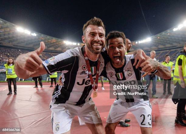 Andrea Barzagli, Dani Alves celebrates after winning the TIM Cup Final match against SS Lazio during the Tim Cup football match F.C. Juventus vs S.S....