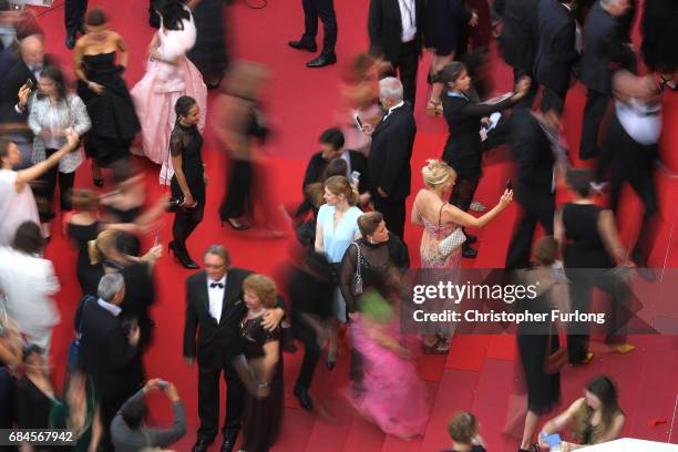 Guests take selfies as they arrive for the screening of 'Loveless ' screening during the 70th annual Cannes Film Festival at Palais des Festivals on...