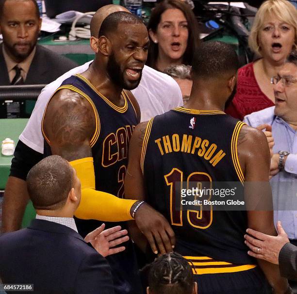 Cleveland Cavaliers forward LeBron James has some words for Cleveland Cavaliers center Tristan Thompson after he and Boston Celtics guard Marcus...