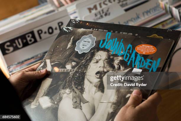 Fan shops for Soundgarden records at Light In The Attic Records inside the KEXP radio studio on May 18, 2017 in Seattle, Washington. Musician Chris...