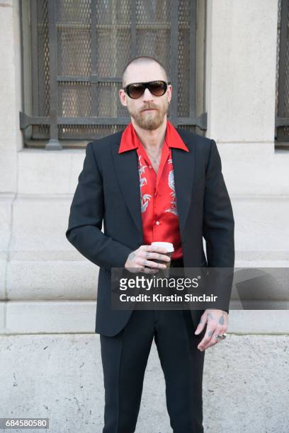 Fashion buyer and founder of Menswear label SSS World Corp Justin O'Shea wears a Louis Vuitton shirt, Acne sunglasses and an SSS World Corp suit on...
