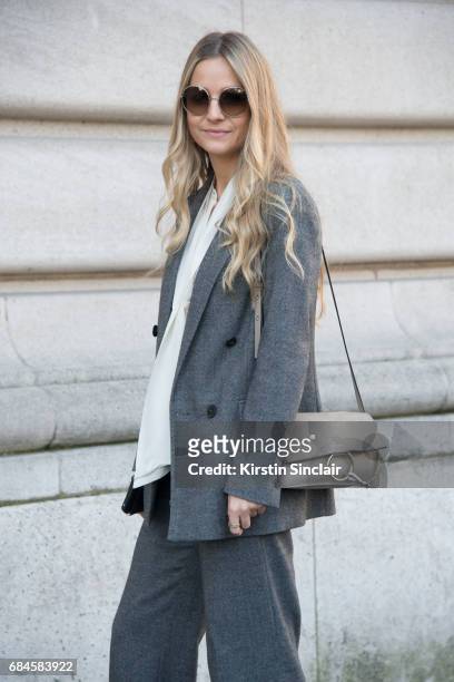 Senior buyer at Net a Porter Holly Estelle Russell wears a Chloe bag, Prada suit, Iris and Ink shirt on day 3 during Paris Fashion Week Autumn/Winter...