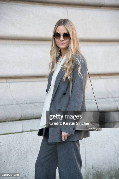 Senior buyer at Net a Porter Holly Estelle Russell wears a Chloe bag, Prada suit, Iris and Ink shirt on day 3 during Paris Fashion Week Autumn/Winter...