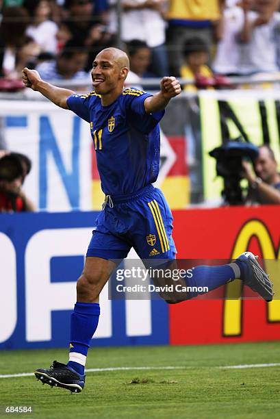 Henrik Larsson of Sweden celebrates scoring the winning goal from the penalty spot during the FIFA World Cup Finals 2002 Group F match between Sweden...