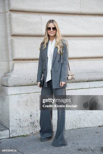 Senior buyer at Net a Porter Holly Estelle Russell wears a Chloe bag, Prada suit, Iris and Ink shirt on day 3 during Paris Fashion Week Autumn/Winter...