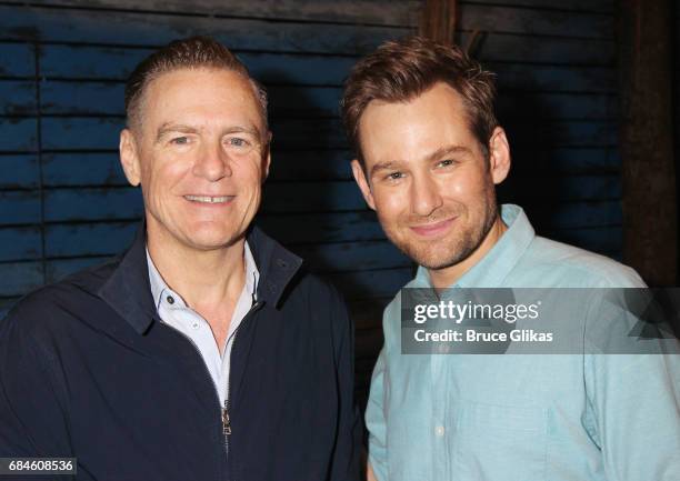 Bryan Adams and Chad Kimball pose backstage at the hit musical "Come From Away" on Broadway at The Gerald Schoenfeld Theatre on May 18, 2017 in New...