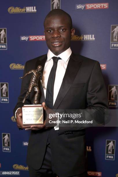 Chelsea Midfielder N'Golo Kante is presented with the FWA Player of the Year Award by Football Writers Association Chairman Patrick Barclay, at The...