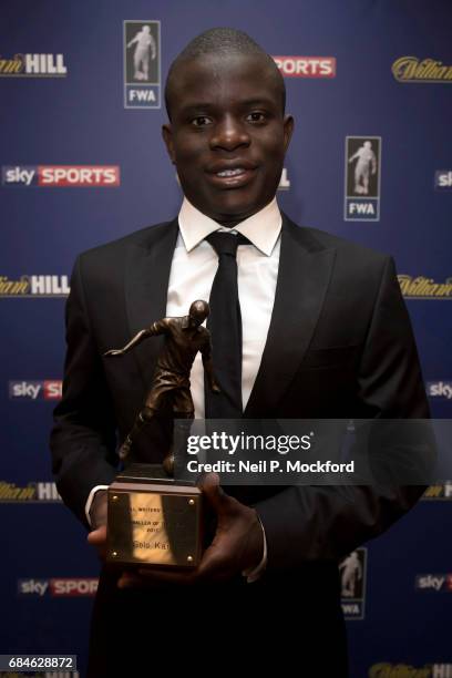 Chelsea Midfielder N'Golo Kante is presented with the FWA Player of the Year Award by Football Writers Association Chairman Patrick Barclay, at The...