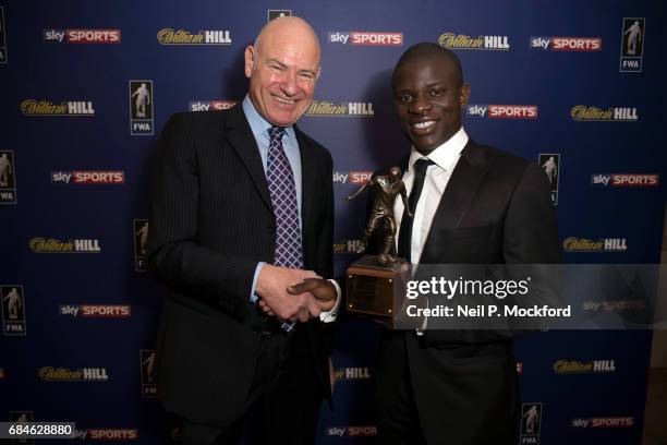 Chelsea Midfielder N'Golo Kante is presented with the FWA Player of the Year Award by Football Writers Association Chairman Patrick Barclay, at The...